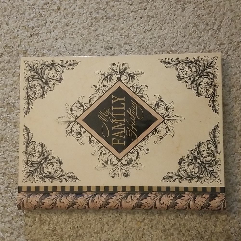 Elegant Family History Book with Black and Cream Design